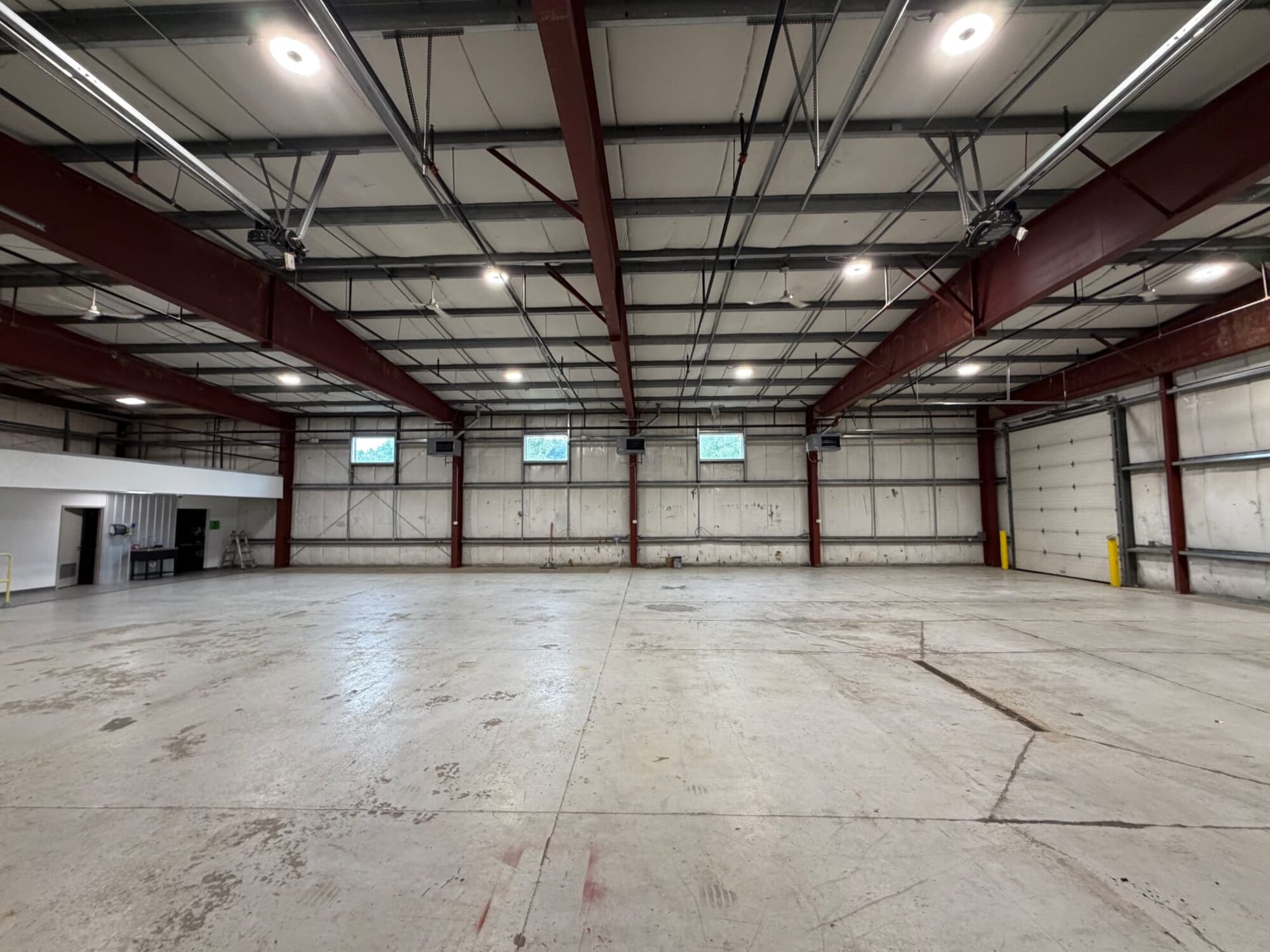 Steel bays and open training floor inside the flagship build